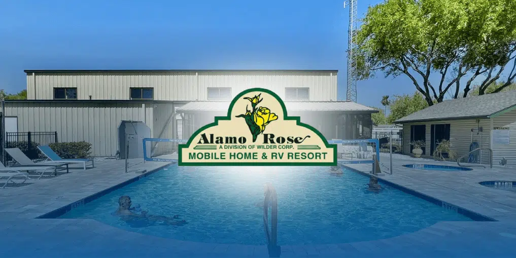 People swimming in the outdoor pool at Alamo Rose Mobile Home & RV Resort.