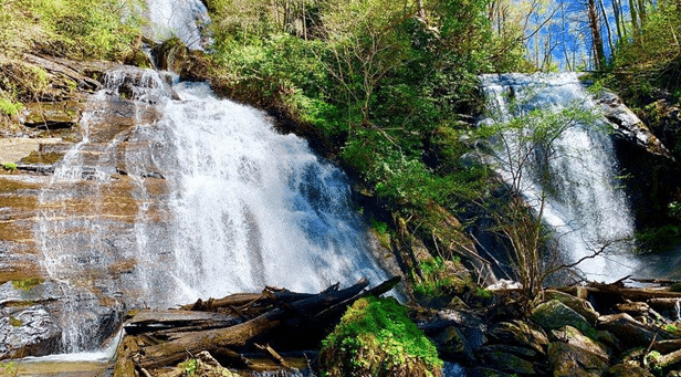 Scenic view of Anna Ruby Falls and Tallulah Gorge in North Georgia, featuring cascading waterfalls, steep cliffs, and forested landscapes.