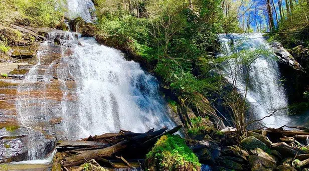Scenic view of Anna Ruby Falls and Tallulah Gorge in North Georgia, featuring cascading waterfalls, steep cliffs, and forested landscapes.