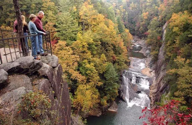 Scenic view of Anna Ruby Falls and Tallulah Gorge in North Georgia, featuring cascading waterfalls, steep cliffs, and forested landscapes.