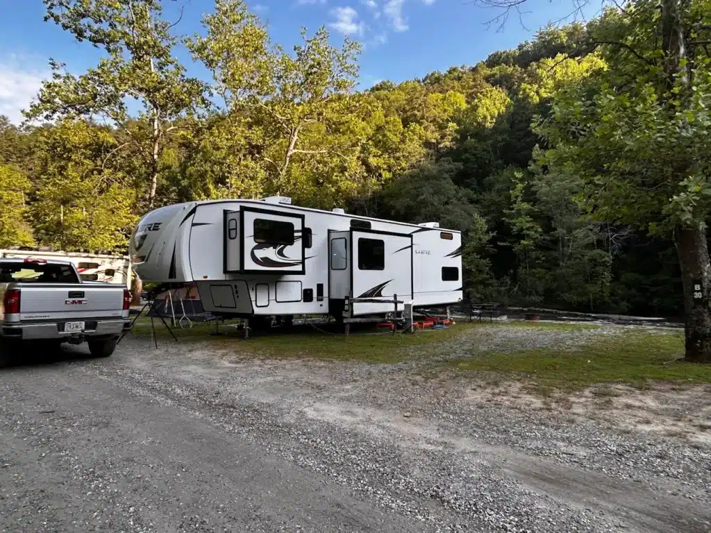 RV campsite at River Falls at the Gorge surrounded by trees and mountain scenery in Georgia