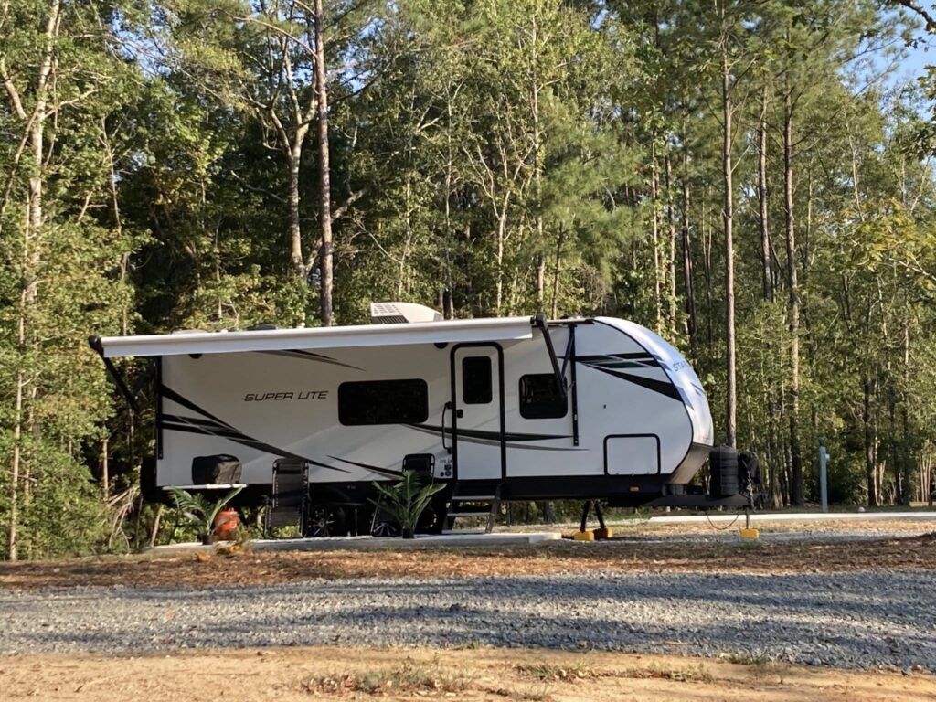 RV campsite at RV Park of Dublin surrounded by pine trees in Georgia