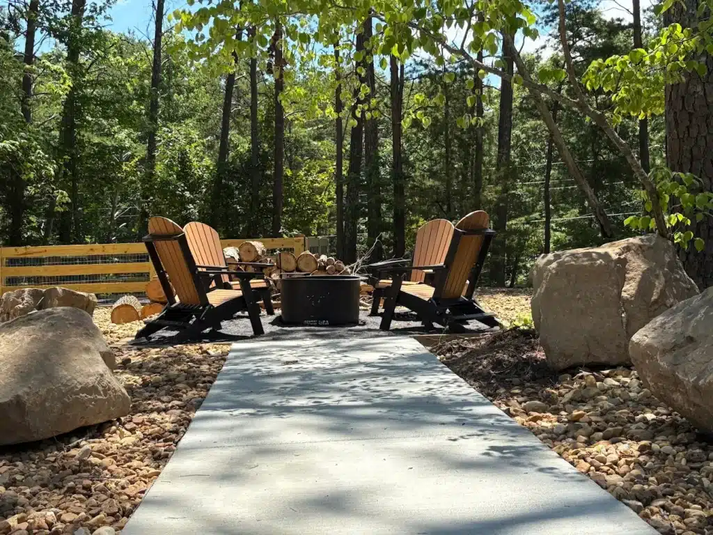 Outdoor fire pit seating area at Nestle Inn RV Resort.