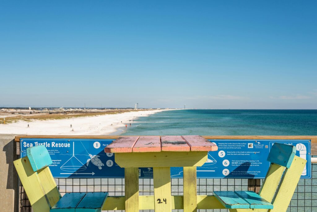 Coastal pier view with ocean chairs