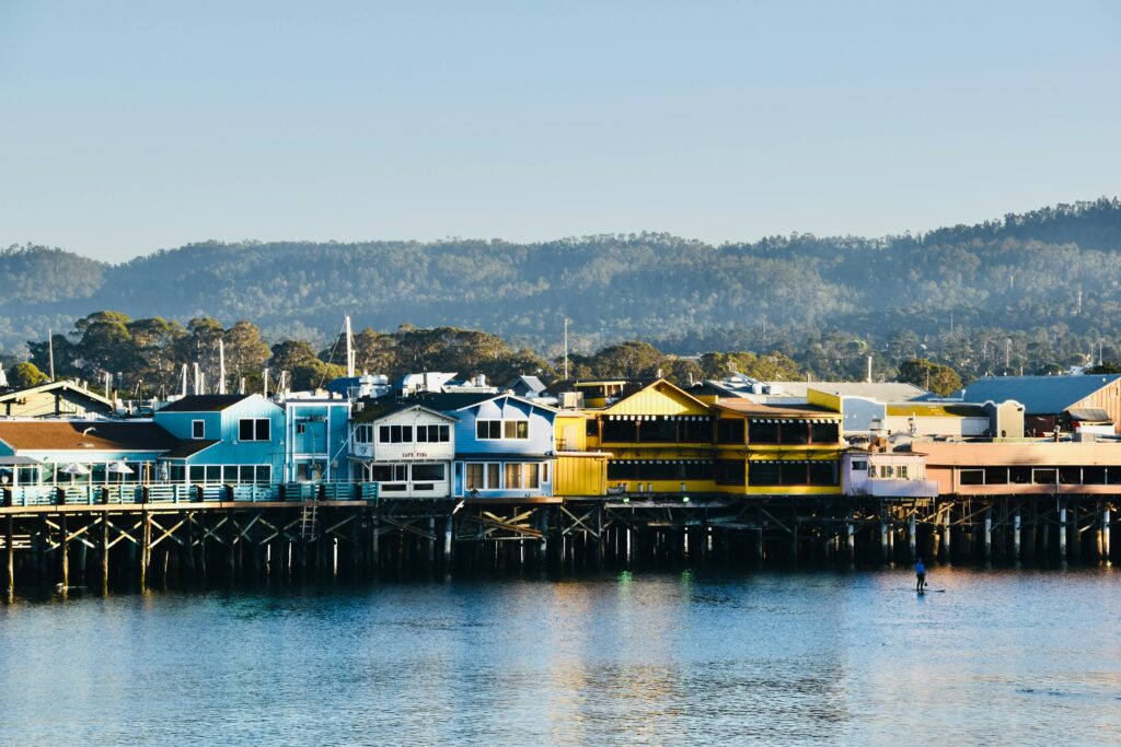 Colorful waterfront buildings near Old Fisherman’s Wharf in Monterey, California at sunset