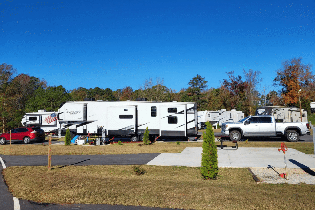 Large RV parked at a paved site at Atlanta South RV Resort.
