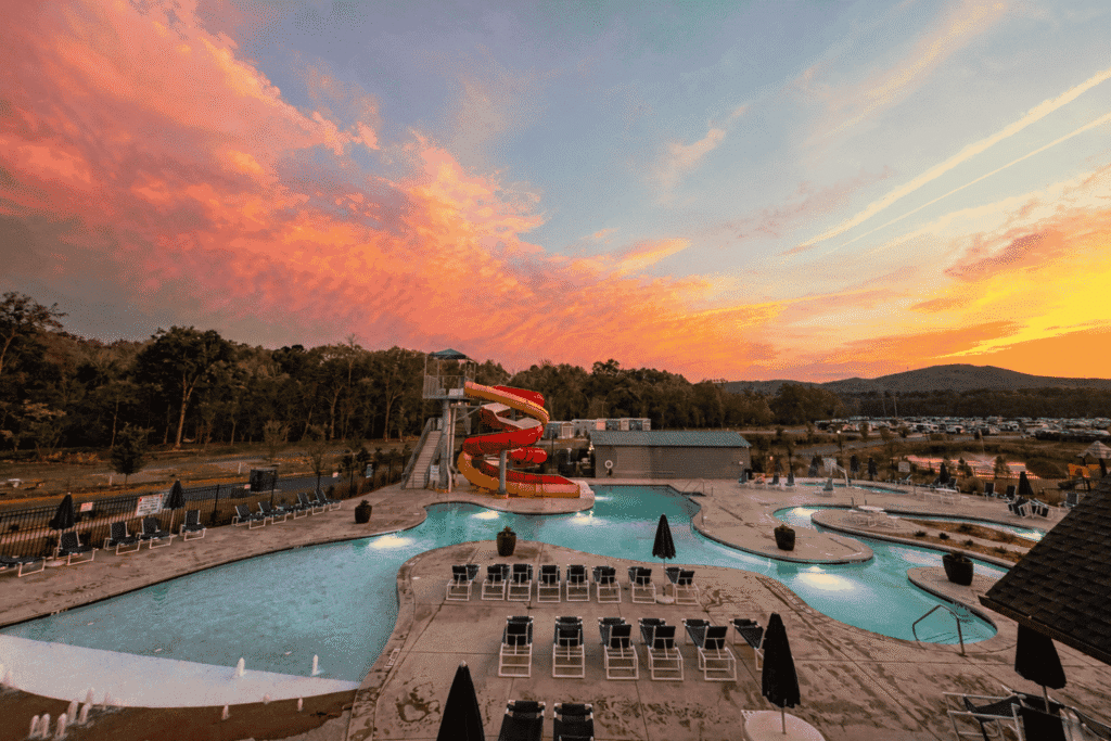 Sunset pool and water slide at Winding Waters RV Resort