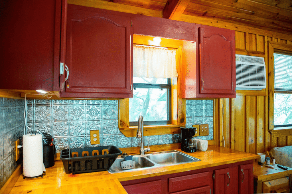 Fully equipped cabin kitchen at The Retreat RV Campground on Styx River