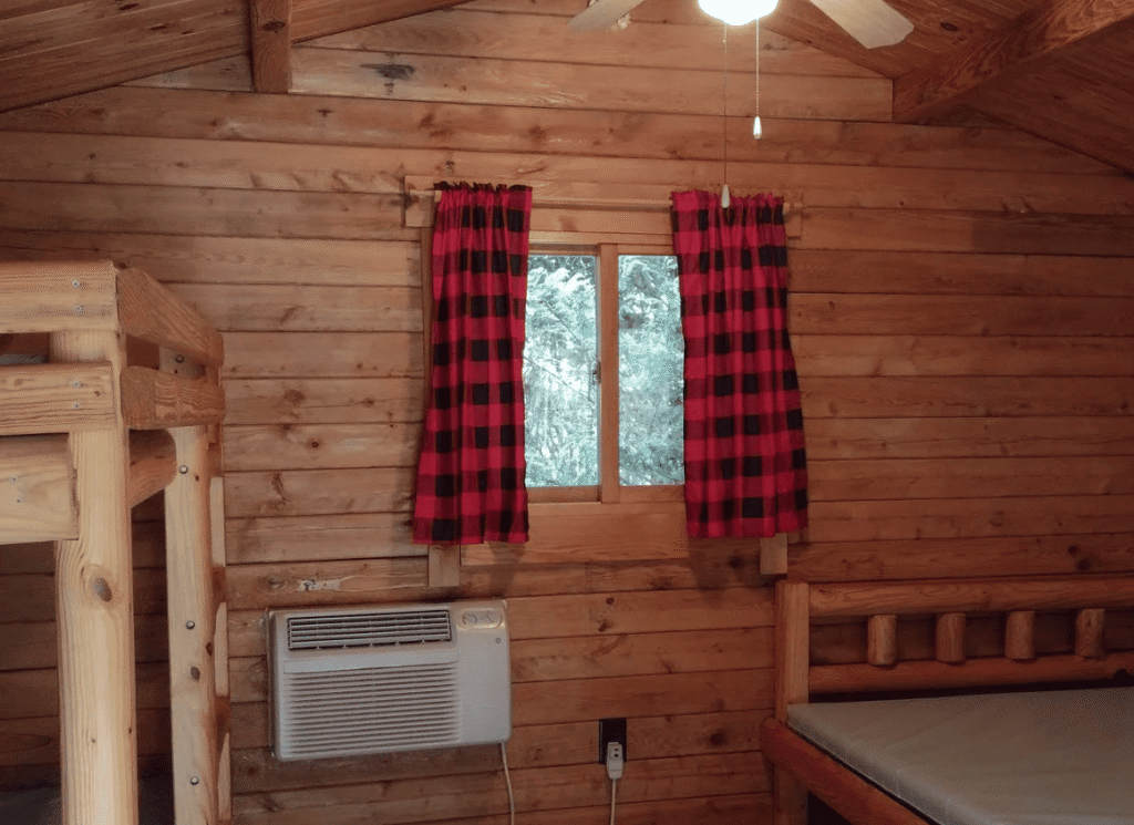 Rustic cabin interior at Whispering Pines Campground